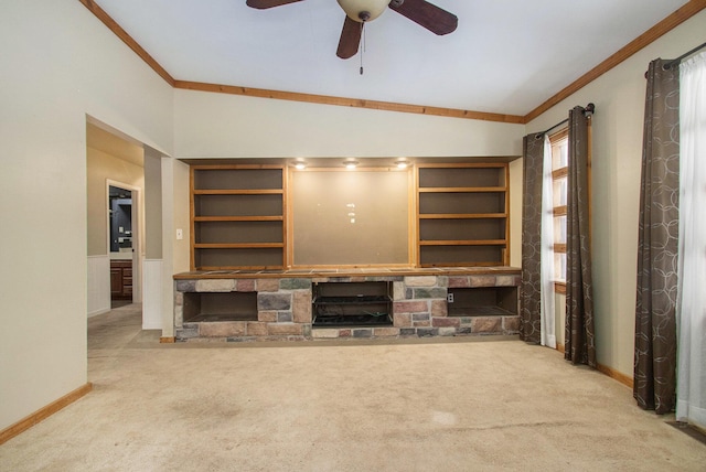 unfurnished living room with light carpet, vaulted ceiling, ceiling fan, and a stone fireplace