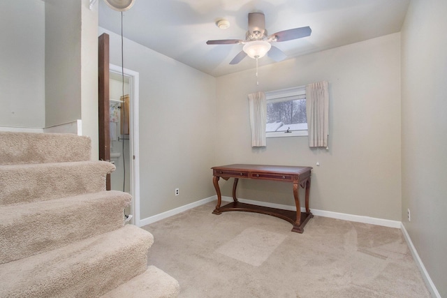 stairs featuring carpet flooring and ceiling fan