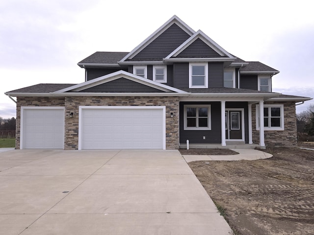 view of front of house with a garage and covered porch