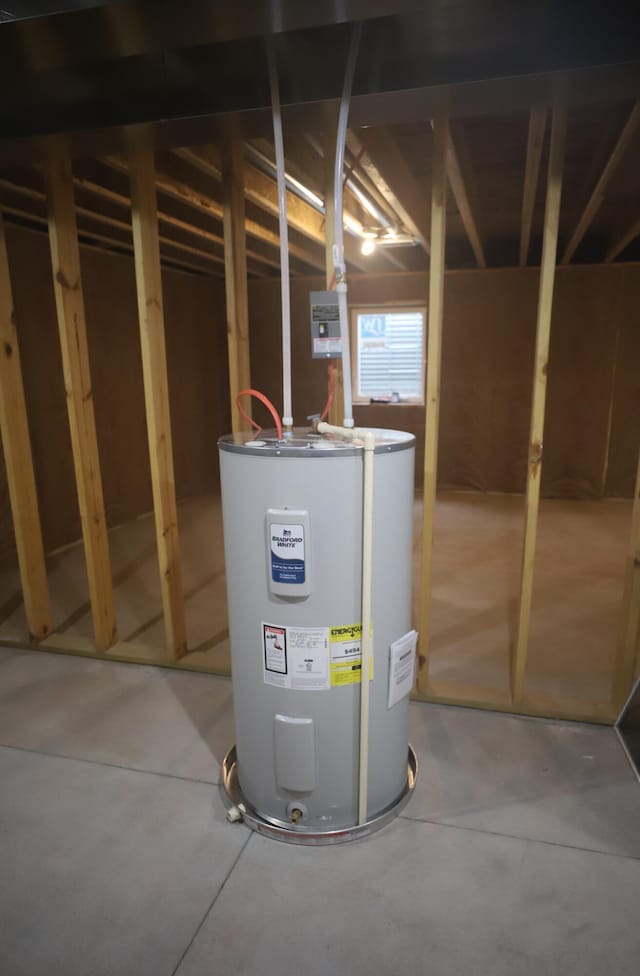 utility room featuring water heater