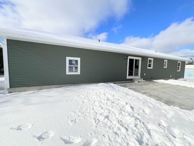 view of snow covered house