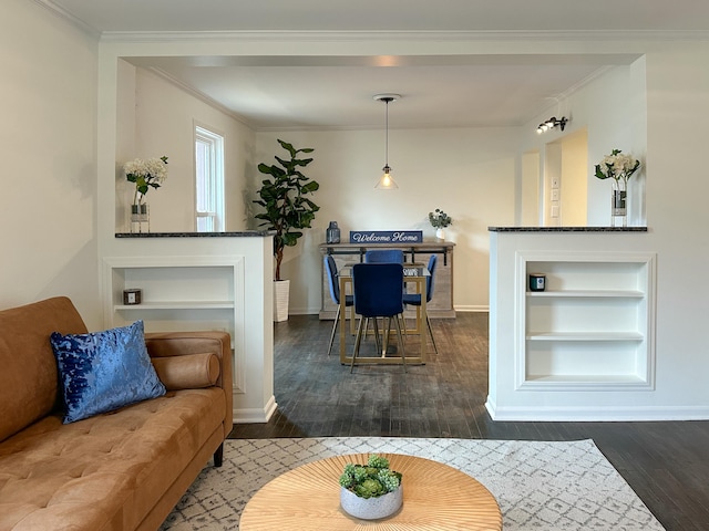 living room featuring dark hardwood / wood-style floors and ornamental molding