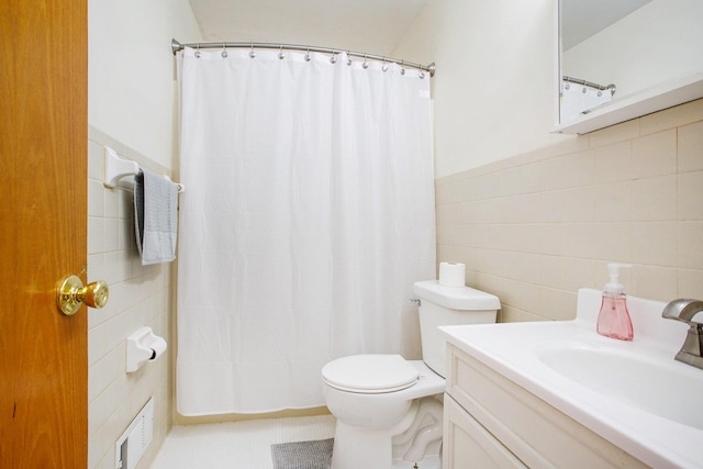 bathroom featuring vanity, a shower with shower curtain, tile walls, and toilet