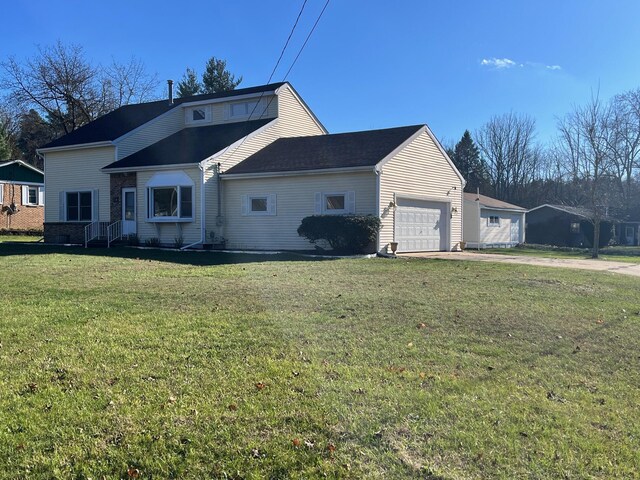 view of home's exterior with a lawn and a garage