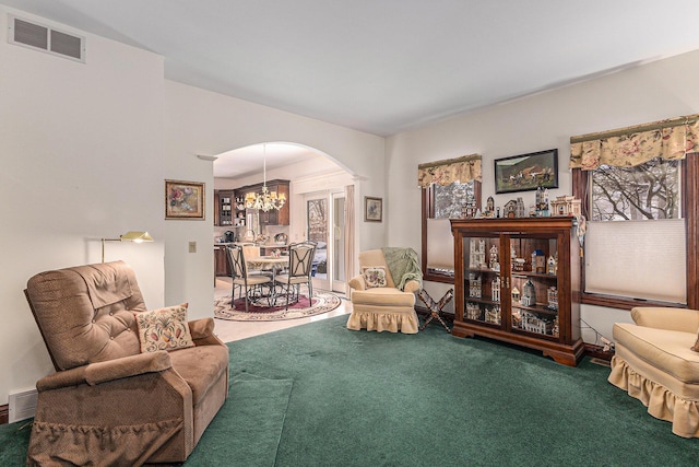 sitting room featuring carpet flooring and a chandelier