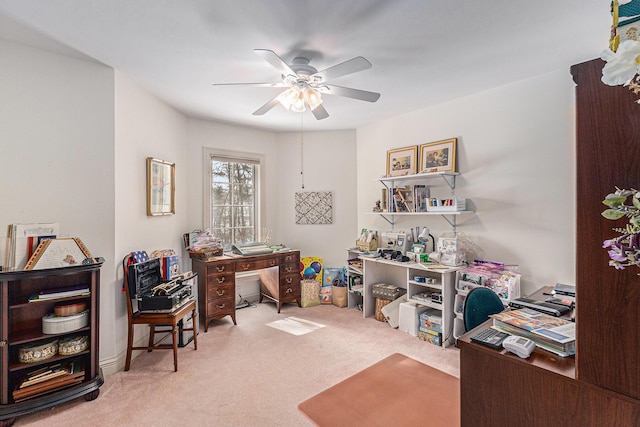 carpeted home office with ceiling fan