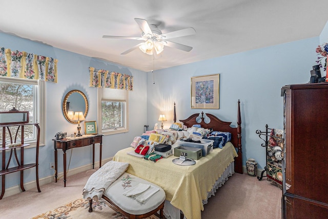 bedroom featuring ceiling fan and light colored carpet