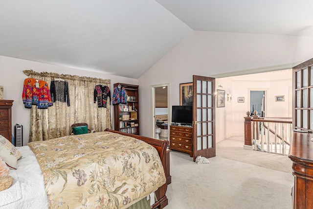 bedroom with light carpet and vaulted ceiling