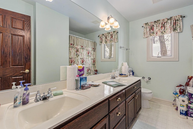 bathroom with vanity and toilet