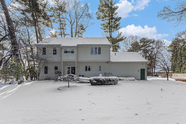 view of snow covered house