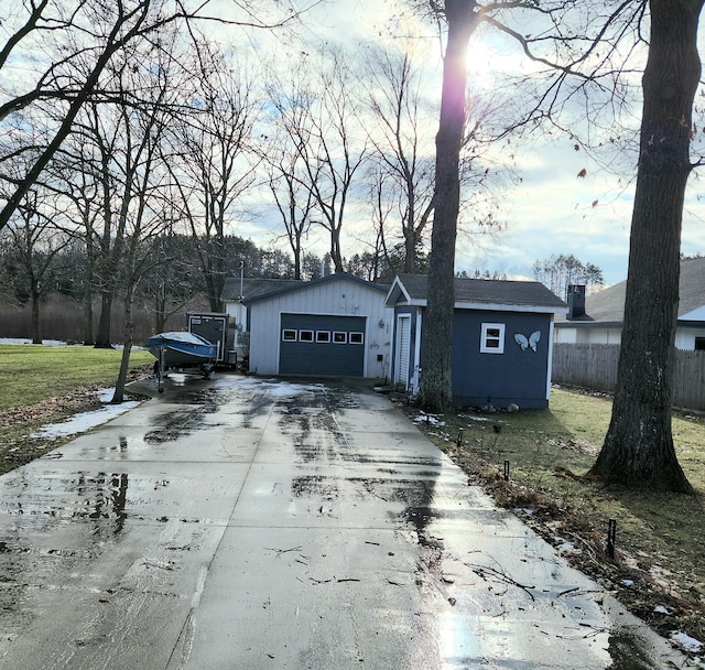 view of front of home featuring a garage and a front lawn