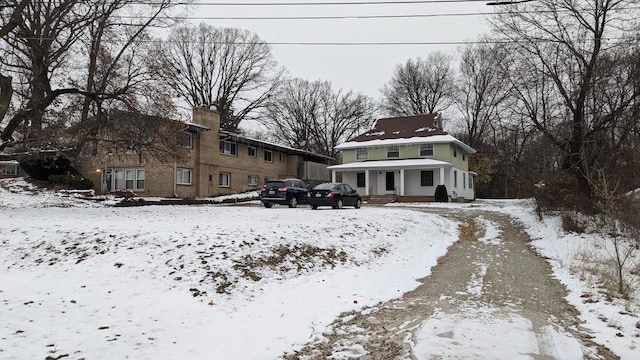 view of snow covered house