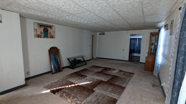 unfurnished living room featuring light carpet