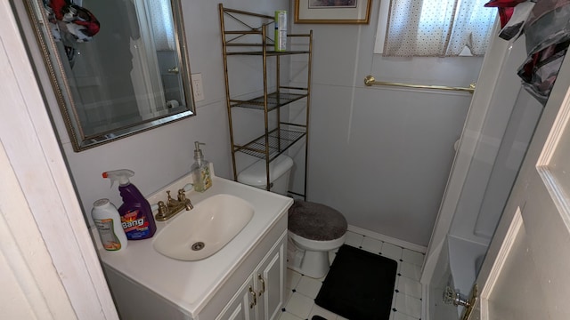 bathroom with vanity, toilet, and walk in shower