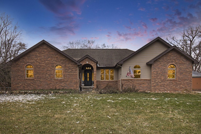 view of front of property with a lawn