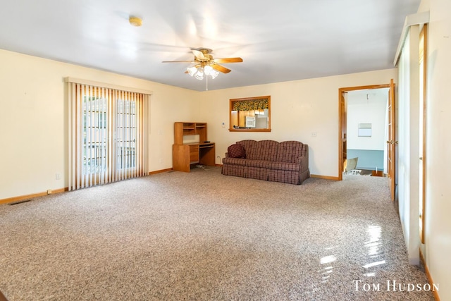 living room with carpet floors and ceiling fan