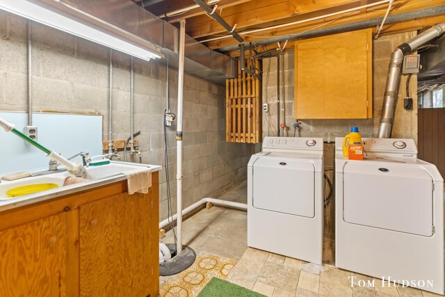 laundry room featuring washer and dryer and sink