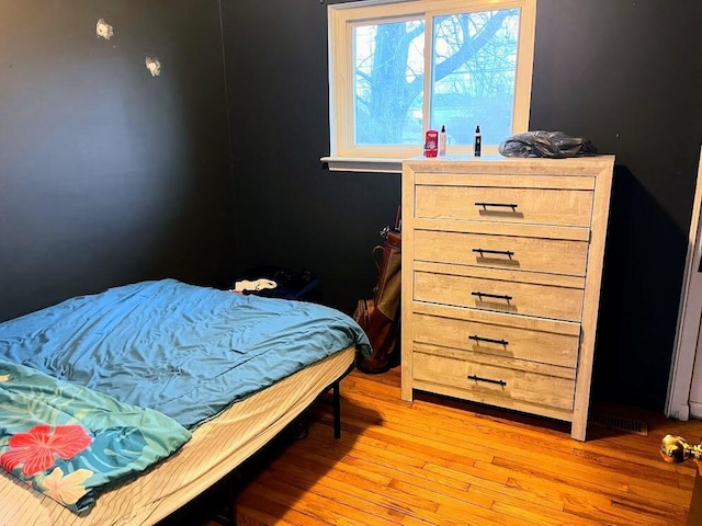 bedroom with light hardwood / wood-style floors