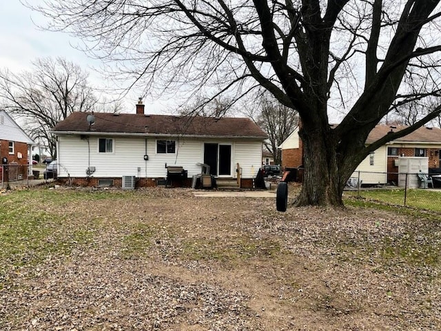 back of house featuring cooling unit