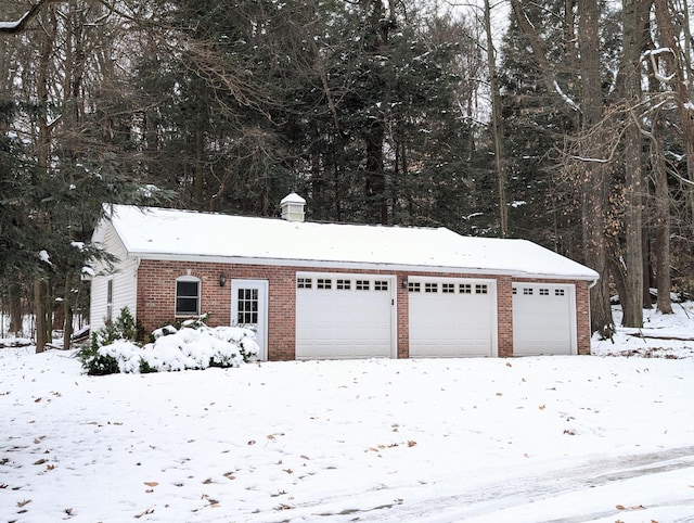 view of snow covered garage