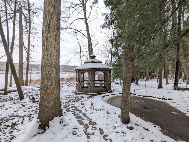 yard covered in snow featuring a gazebo