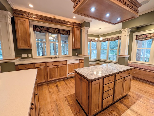 kitchen with dishwasher, crown molding, decorative light fixtures, light hardwood / wood-style flooring, and a notable chandelier