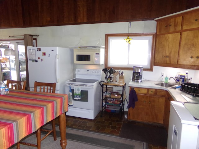 kitchen with sink and white appliances