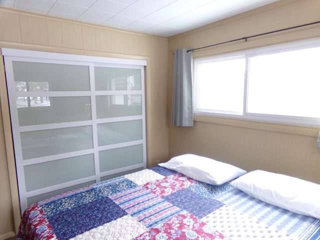 bedroom with ornamental molding