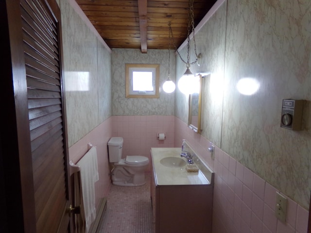 bathroom with toilet, radiator heating unit, beamed ceiling, wood ceiling, and tile patterned flooring