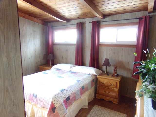 bedroom with wood-type flooring, wooden walls, beamed ceiling, and wood ceiling