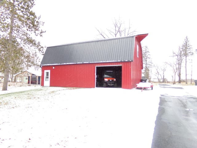 view of snow covered garage