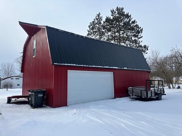 view of snow covered garage