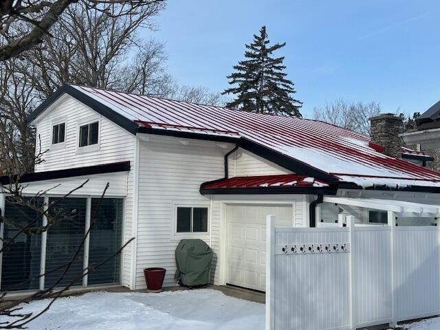 view of property exterior with a garage