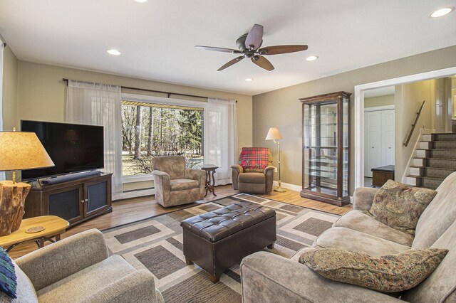 7293 M-116, Ludington, MI 49431 - living room with baseboard heating, recessed lighting, a ceiling fan, and wood finished floors