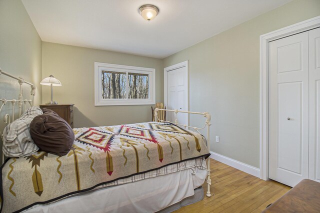 7293 M-116, Ludington, MI 49431 - bedroom featuring wood finished floors and baseboards