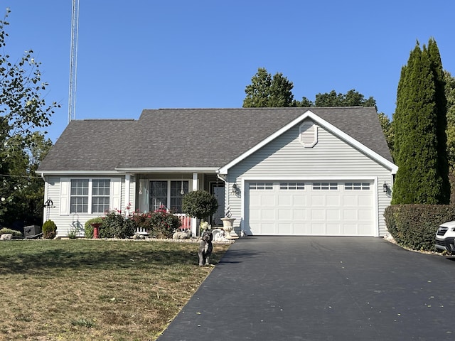 single story home with a front yard and a garage