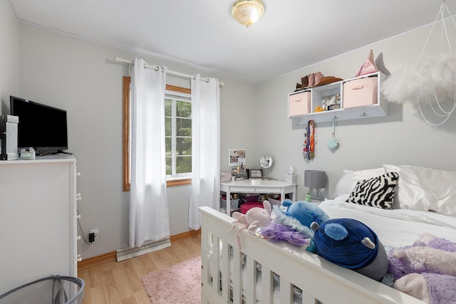 bedroom with light hardwood / wood-style flooring