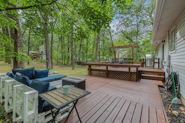 wooden deck featuring an outdoor hangout area