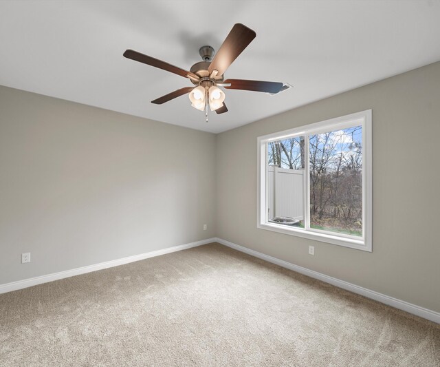 unfurnished room featuring carpet flooring and ceiling fan