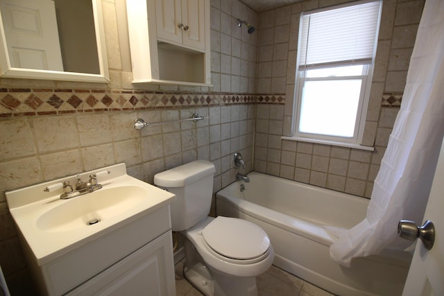 full bathroom with vanity, tile patterned flooring, toilet, shower / bathtub combination with curtain, and tile walls