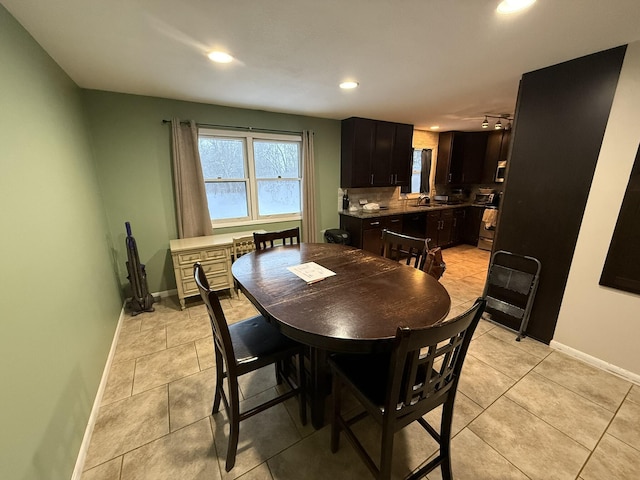 tiled dining room with sink