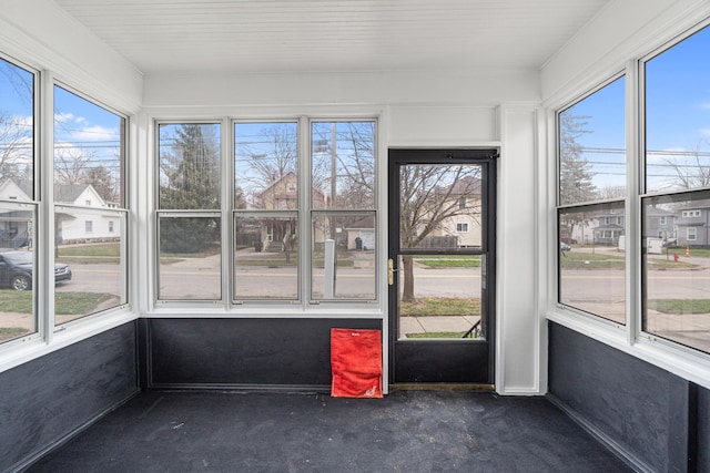 unfurnished sunroom featuring plenty of natural light