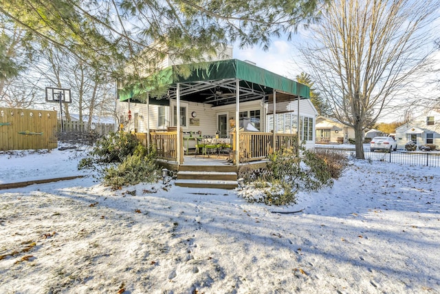 view of snow covered house