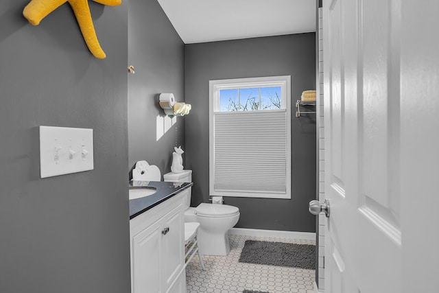 bathroom with tile patterned floors, vanity, and toilet