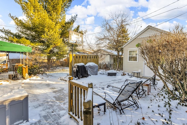 view of snow covered deck