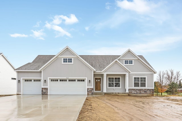 craftsman-style home with a garage