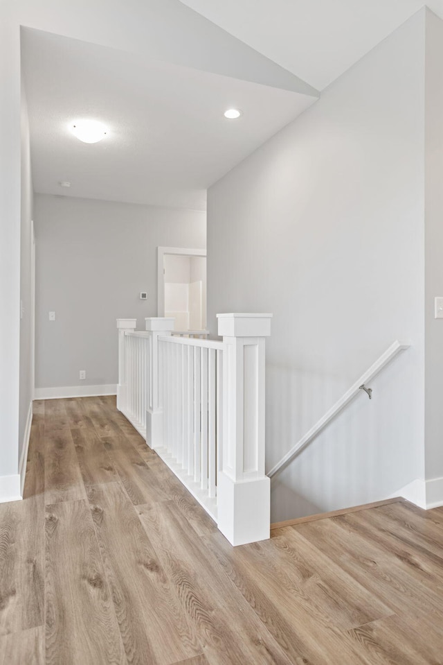 corridor featuring light hardwood / wood-style floors