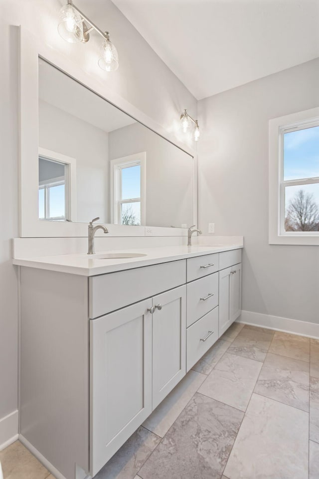 bathroom featuring plenty of natural light and vanity