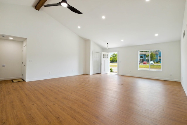 unfurnished living room featuring beamed ceiling, high vaulted ceiling, and light hardwood / wood-style flooring