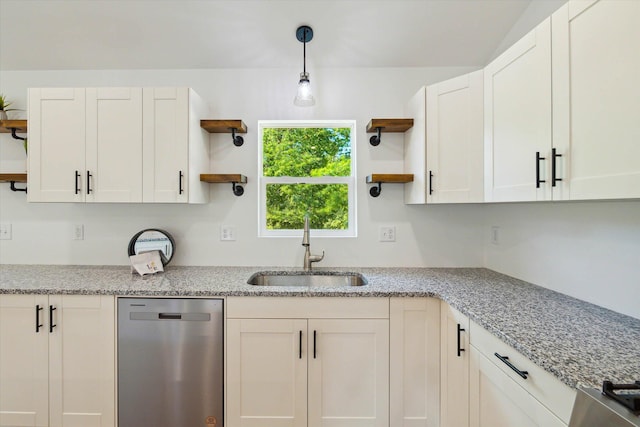 kitchen featuring white cabinets, dishwasher, light stone countertops, and sink